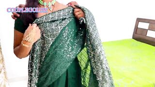 Komal was doing makeup, applying lipstick in front of the mirror