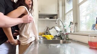 Horny wife gets fucked in the kitchen while doing the dishes