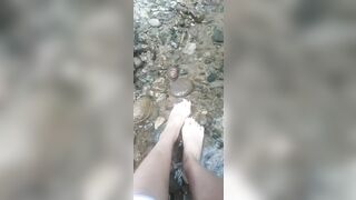 Latina Feet Play in Water